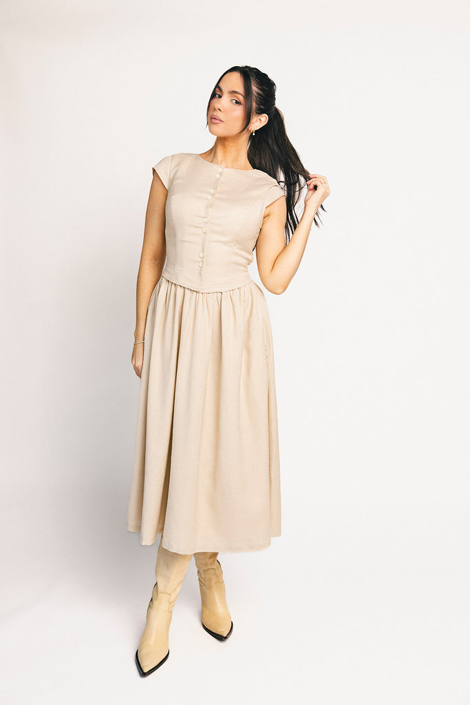 vintage-inspired dress with a fitted button-up bodice. the perfect neutral short sleeve dress for family pictures, bridal showers, + semi-formal events.
