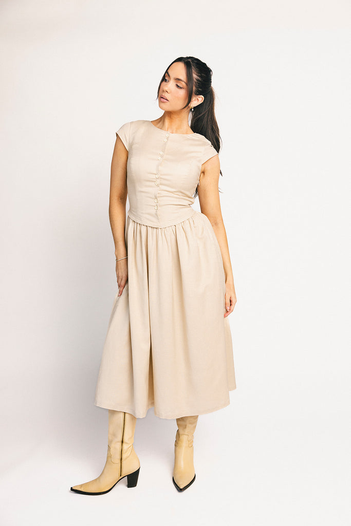 vintage-inspired dress with a fitted button-up bodice. the perfect neutral short sleeve dress for family pictures, bridal showers, + semi-formal events.