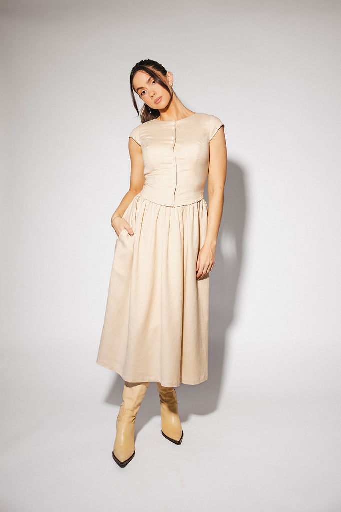 vintage-inspired dress with a fitted button-up bodice. the perfect neutral short sleeve dress for family pictures, bridal showers, + semi-formal events.