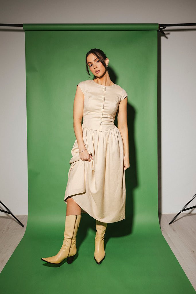 vintage-inspired dress with a fitted button-up bodice. the perfect neutral short sleeve dress for family pictures, bridal showers, + semi-formal events.