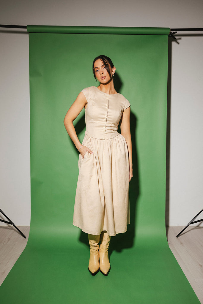 vintage-inspired dress with a fitted button-up bodice. the perfect neutral short sleeve dress for family pictures, bridal showers, + semi-formal events.