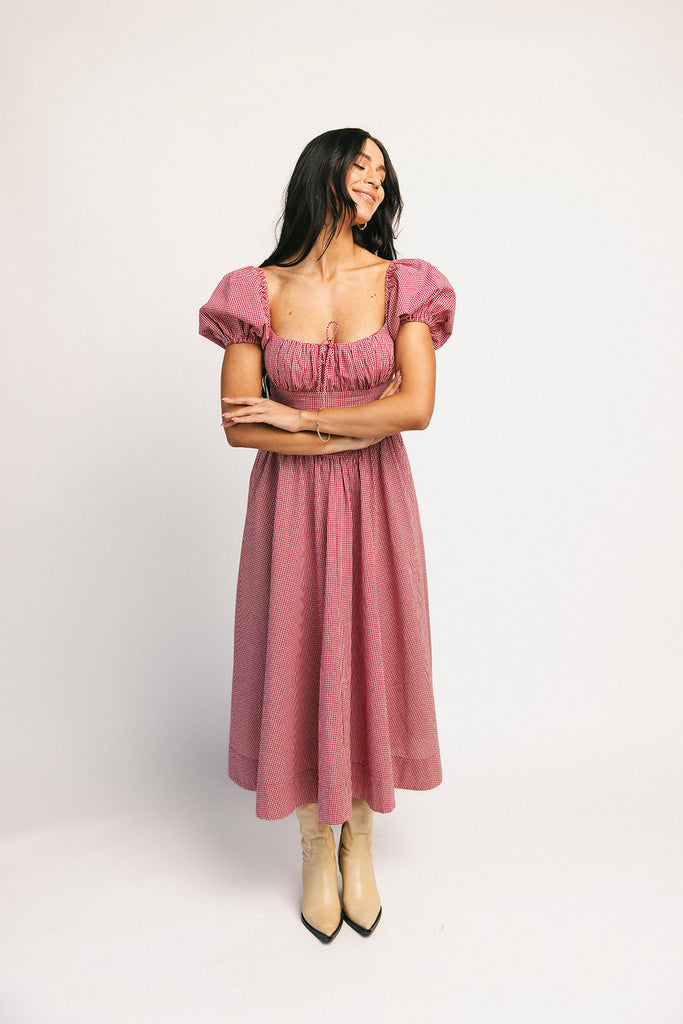 vintage-inspired puff sleeve dress with a square neckline. the perfect red gingham puff sleeve dress for rodeos, family pictures,+ semi-casual occasions.