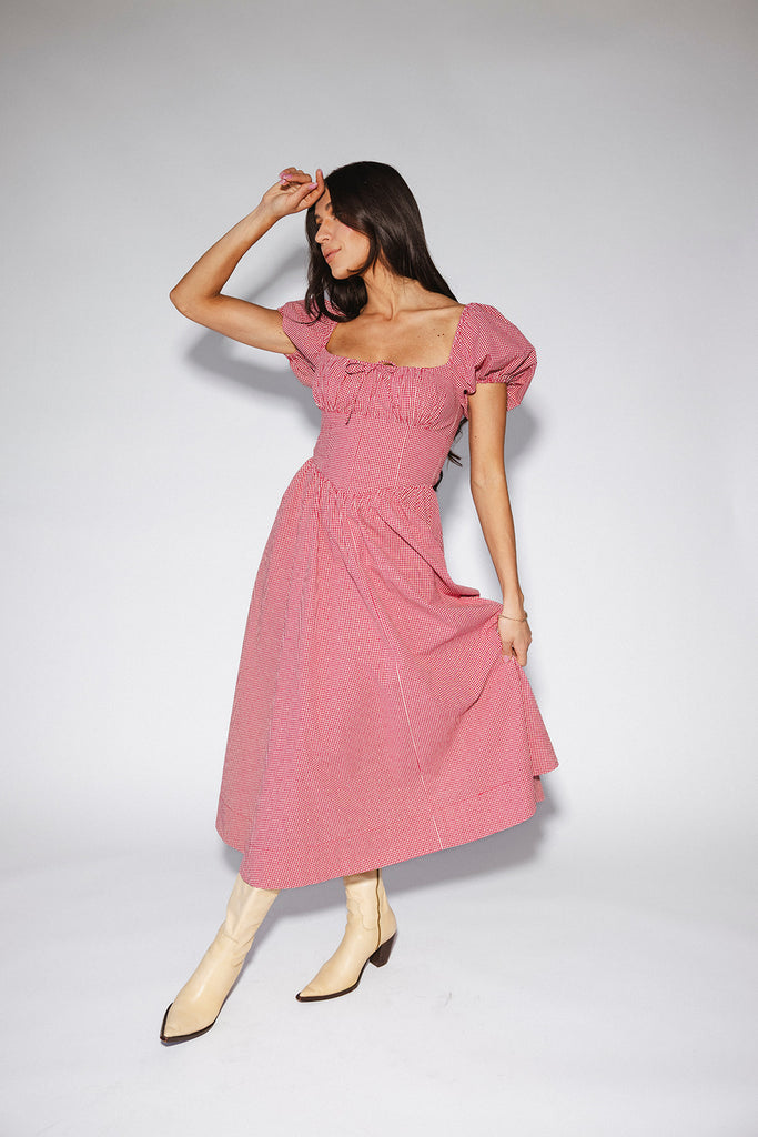 vintage-inspired puff sleeve dress with a square neckline. the perfect red gingham puff sleeve dress for rodeos, family pictures,+ semi-casual occasions.