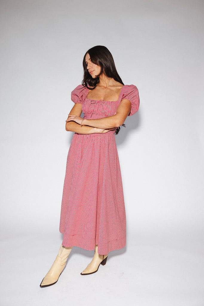vintage-inspired puff sleeve dress with a square neckline. the perfect red gingham puff sleeve dress for rodeos, family pictures,+ semi-casual occasions.