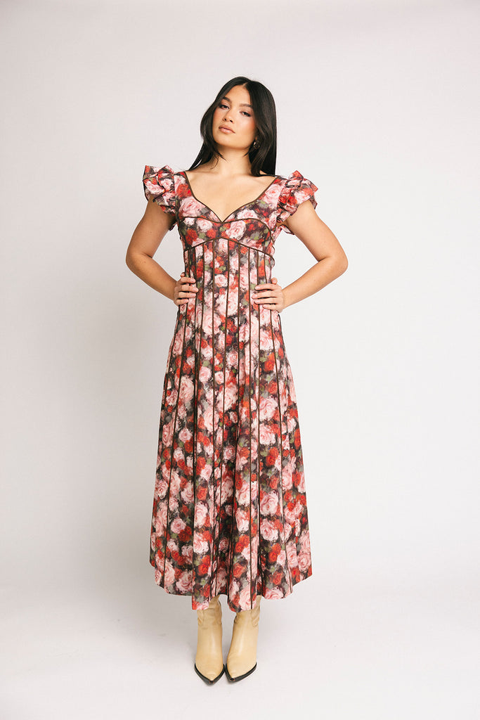 vintage-inspired floral dress with a sweetheart neckline + flutter sleeves. the perfect occasion dress for weddings, bridal showers, + formal events.