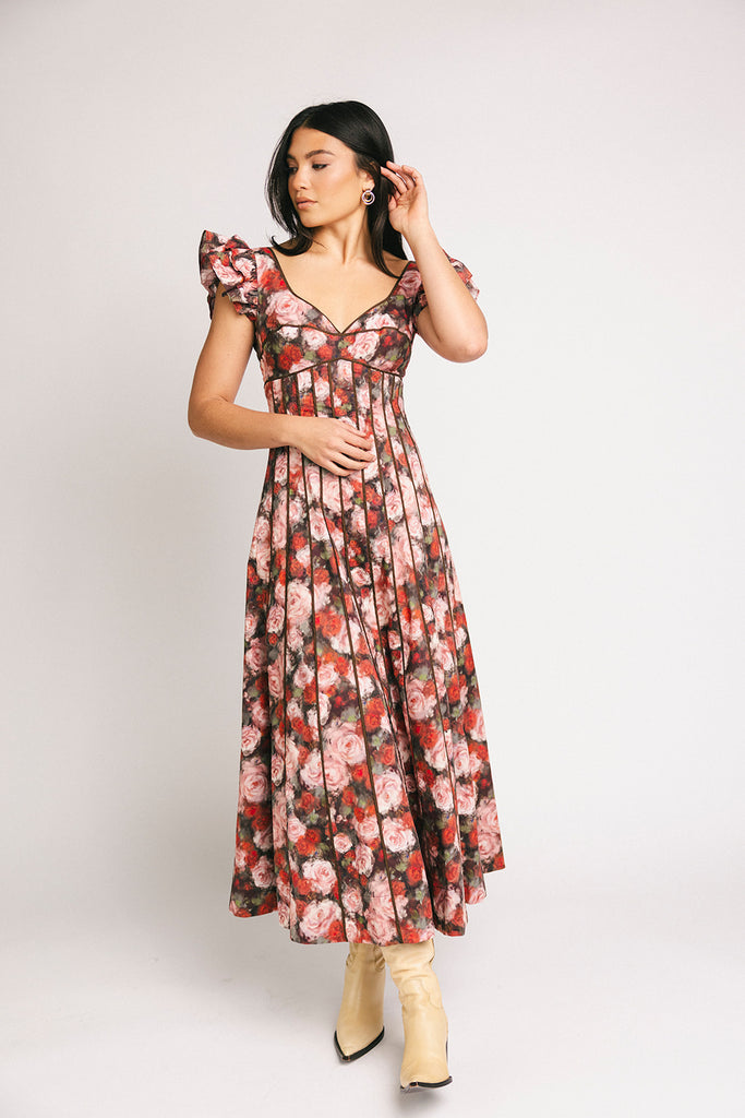 vintage-inspired floral dress with a sweetheart neckline + flutter sleeves. the perfect occasion dress for weddings, bridal showers, + formal events.