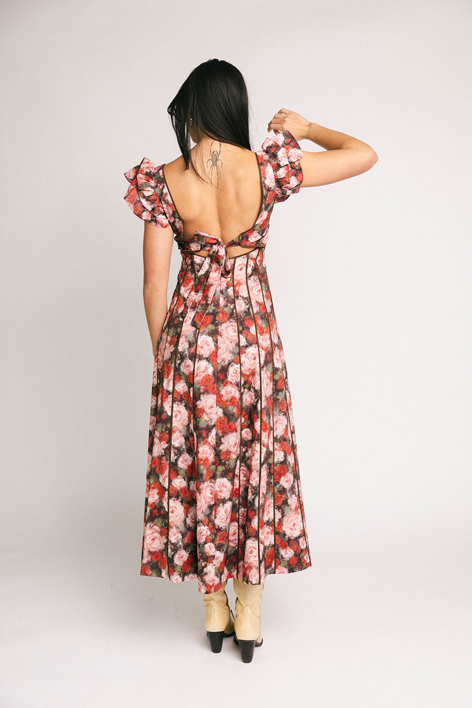 vintage-inspired floral dress with a sweetheart neckline + flutter sleeves. the perfect occasion dress for weddings, bridal showers, + formal events.