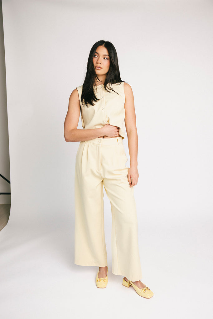 butter yellow pant set with a cropped button up tank + high waisted trousers. the perfect elevated set for the office + everyday wear.