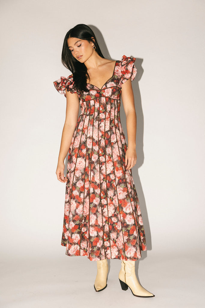 vintage-inspired floral dress with a sweetheart neckline + flutter sleeves. the perfect occasion dress for weddings, bridal showers, + formal events.