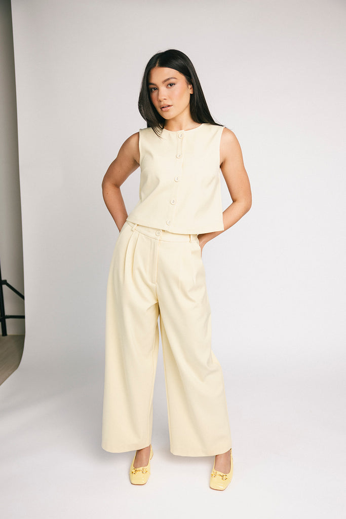 butter yellow pant set with a cropped button up tank + high waisted trousers. the perfect elevated set for the office + everyday wear.