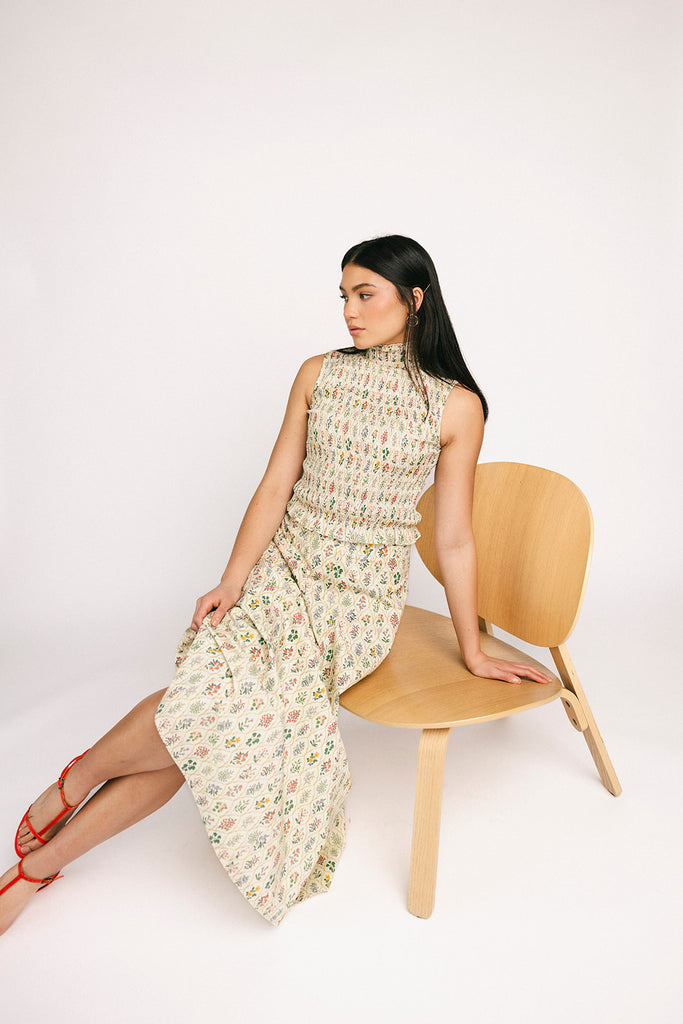 floral skirt set with a smocked mock neck tank + an a-line maxi skirt. the perfect elevated set for vacations, weddings, + fancy date nights.