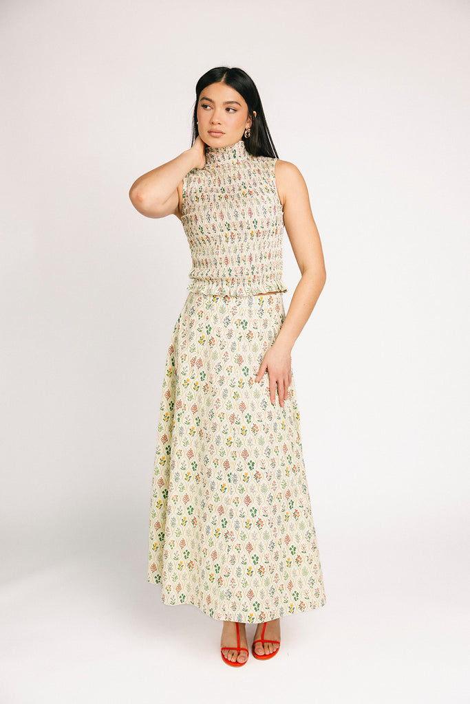 floral skirt set with a smocked mock neck tank + an a-line maxi skirt. the perfect elevated set for vacations, weddings, + fancy date nights.