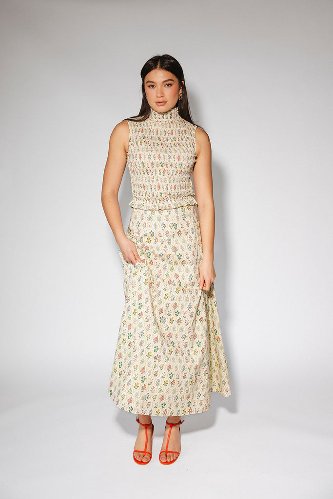 floral skirt set with a smocked mock neck tank + an a-line maxi skirt. the perfect elevated set for vacations, weddings, + fancy date nights.