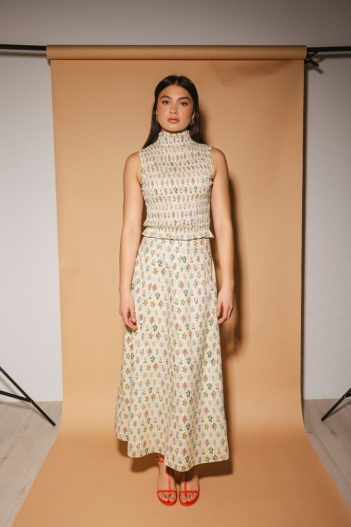 floral skirt set with a smocked mock neck tank + an a-line maxi skirt. the perfect elevated set for vacations, weddings, + fancy date nights.