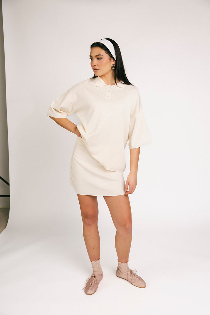 a casual skirt set with an oversized polo top + a fitted mini skirt. the perfect sporty two piece set to dress up or down for any outfit idea.
