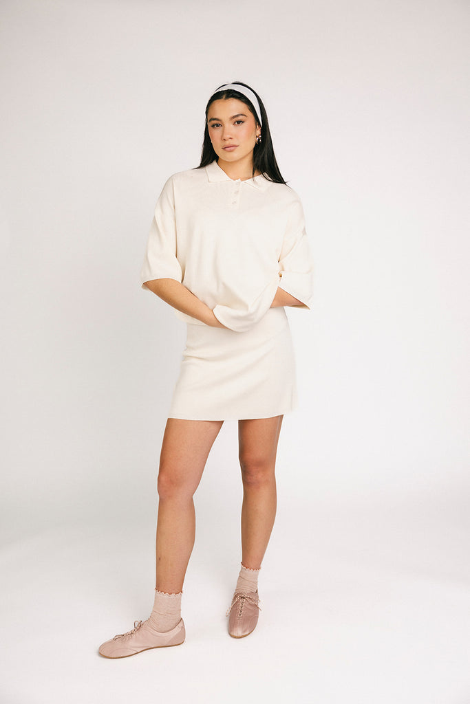 a casual skirt set with an oversized polo top + a fitted mini skirt. the perfect sporty two piece set to dress up or down for any outfit idea.