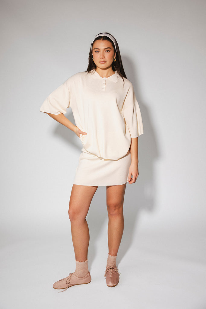 a casual skirt set with an oversized polo top + a fitted mini skirt. the perfect sporty two piece set to dress up or down for any outfit idea.