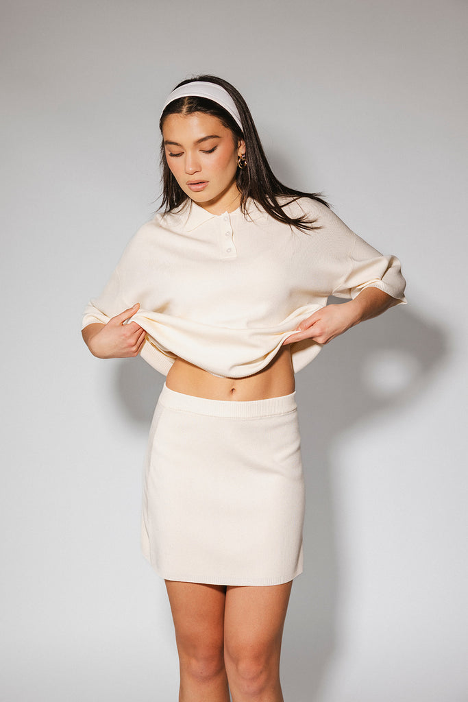 a casual skirt set with an oversized polo top + a fitted mini skirt. the perfect sporty two piece set to dress up or down for any outfit idea.