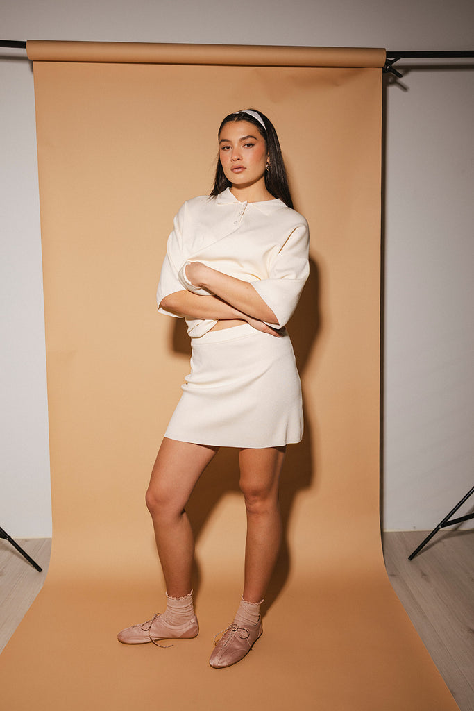 a casual skirt set with an oversized polo top + a fitted mini skirt. the perfect sporty two piece set to dress up or down for any outfit idea.