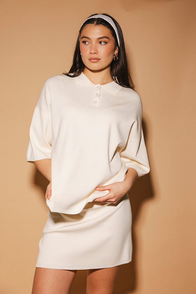 a casual skirt set with an oversized polo top + a fitted mini skirt. the perfect sporty two piece set to dress up or down for any outfit idea.