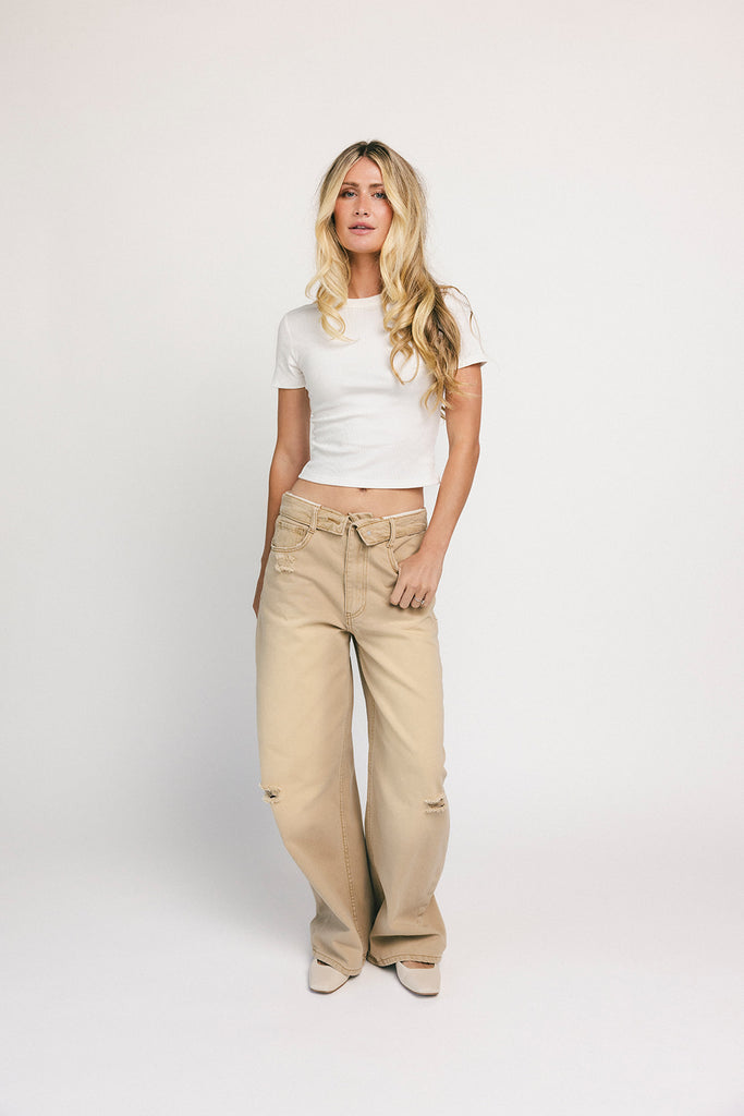 low rise wide leg denim with a folded waistband + distressed details. the perfect y2k-inspired bottoms for date nights + casual wear.