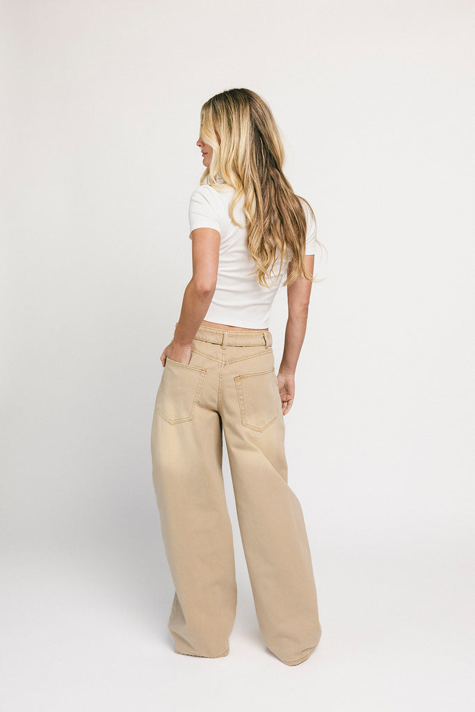 low rise wide leg denim with a folded waistband + distressed details. the perfect y2k-inspired bottoms for date nights + casual wear.