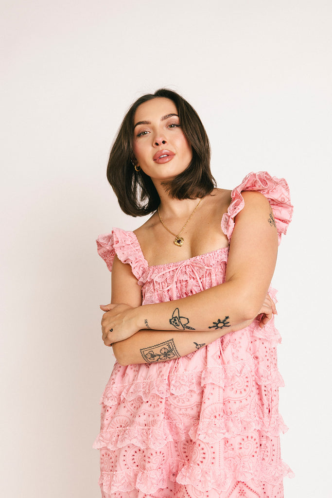 vintage inspired pink lace maxi dress with an elastic neckline and tiered ruffle details. perfect for weddings, bridal showers, and baby showers.