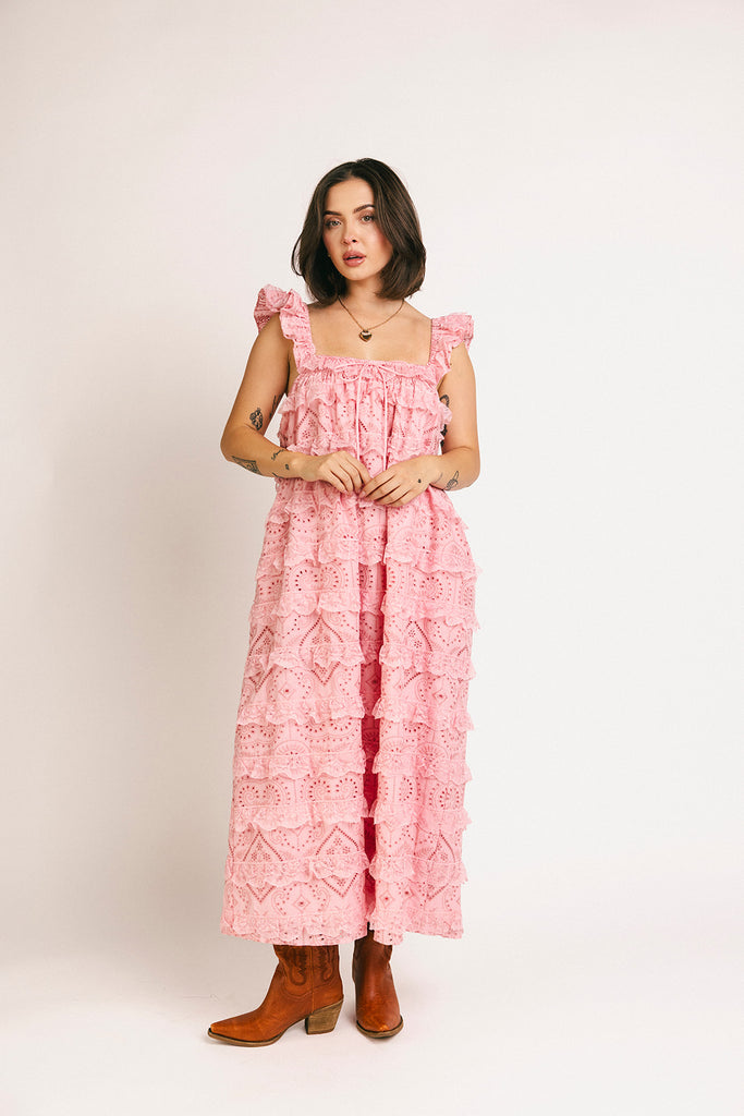 vintage inspired pink lace maxi dress with an elastic neckline and tiered ruffle details. perfect for weddings, bridal showers, and baby showers.