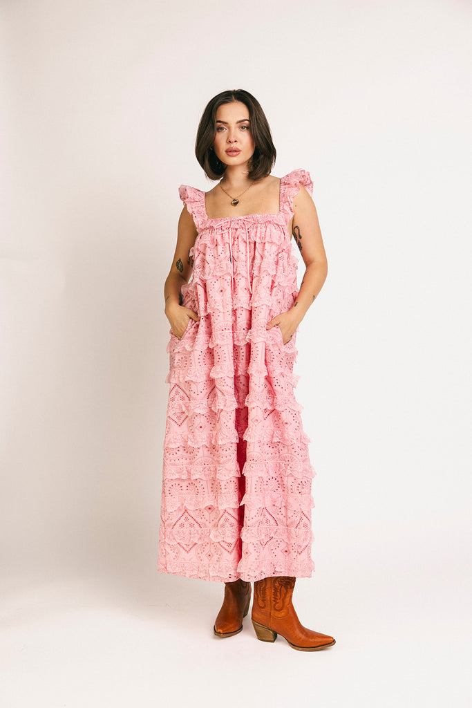 vintage inspired pink lace maxi dress with an elastic neckline and tiered ruffle details. perfect for weddings, bridal showers, and baby showers.