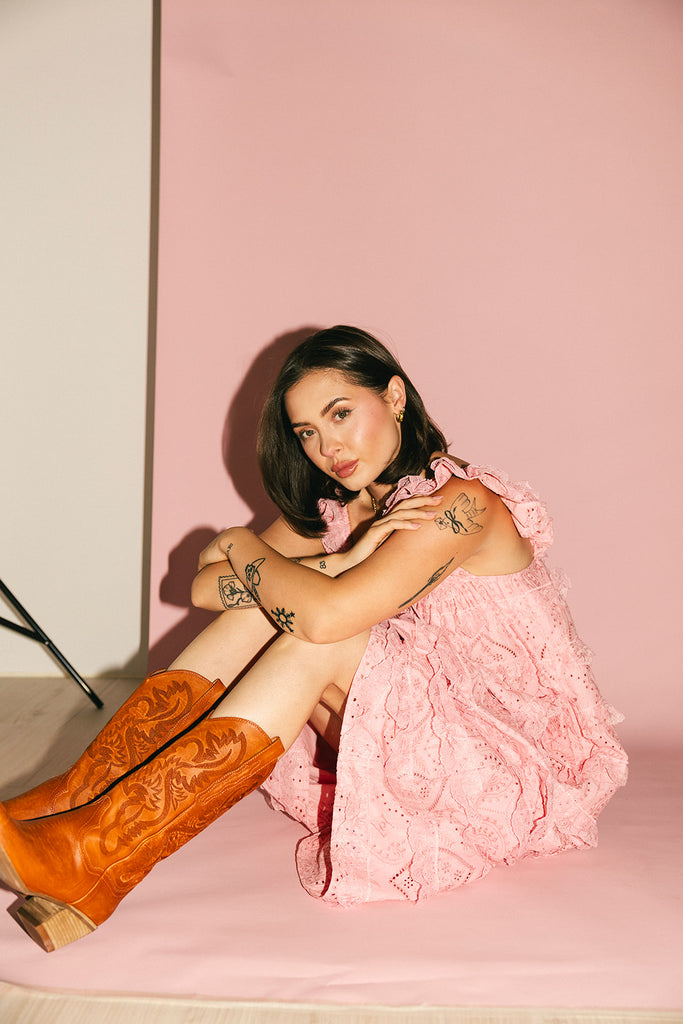 vintage inspired pink lace maxi dress with an elastic neckline and tiered ruffle details. perfect for weddings, bridal showers, and baby showers.