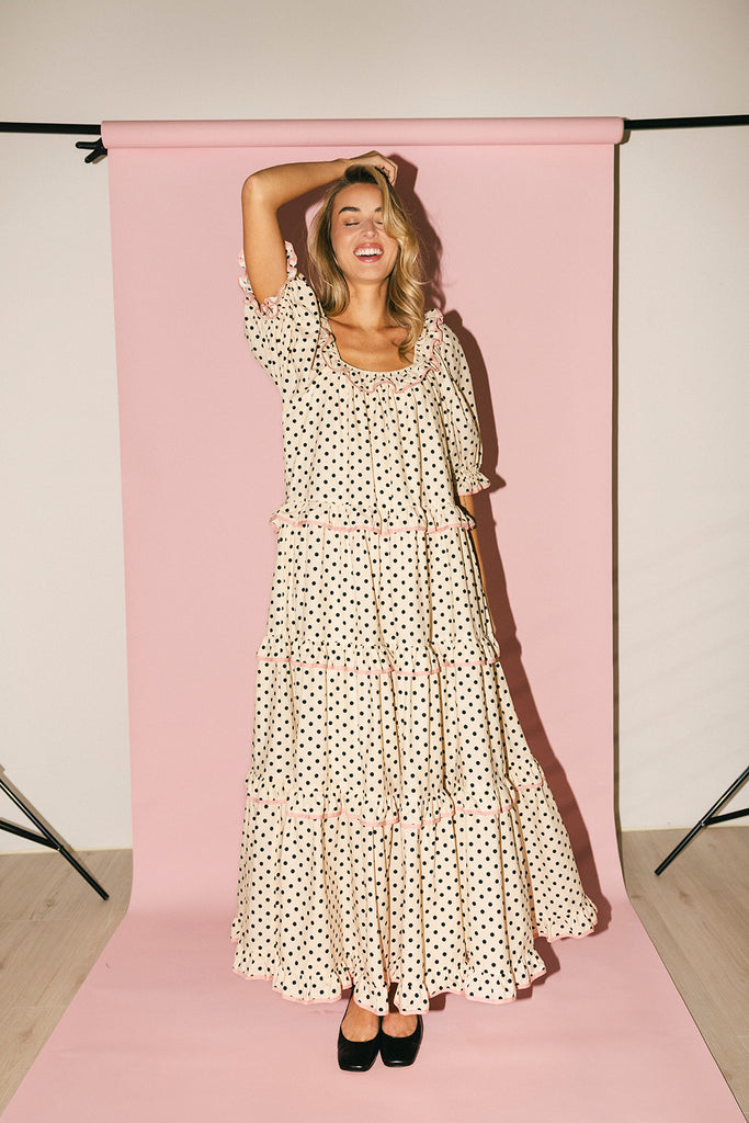 zoco daymaker dress: puff sleeve polka dot dress with an elastic neckline and pink trim details. perfect for weddings, baby showers, and family pictures.