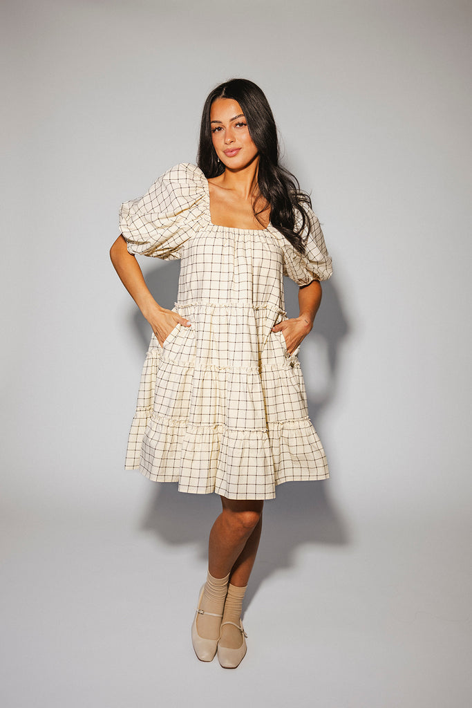 zoco daymaker dress: a short puff sleeve dress with a grid-style pattern + an elastic neckline. perfect for family pictures, weddings, and baby showers.