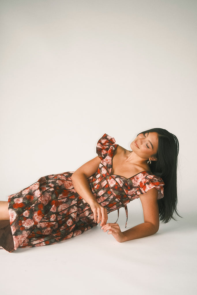 vintage-inspired floral dress with a sweetheart neckline + flutter sleeves. the perfect occasion dress for weddings, bridal showers, + formal events.