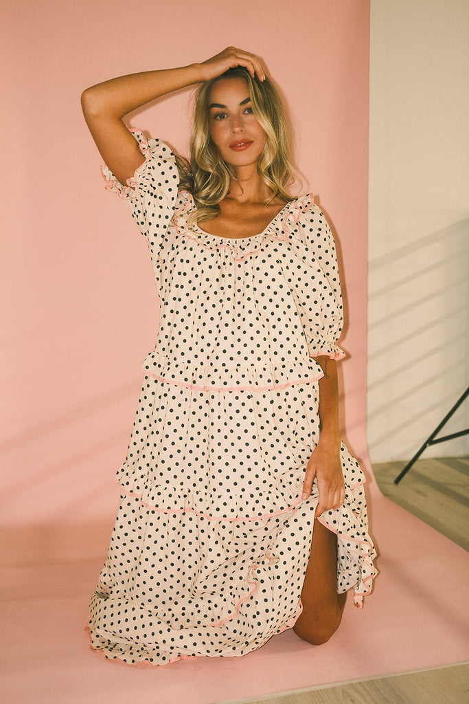 zoco daymaker dress: puff sleeve polka dot dress with an elastic neckline and pink trim details. perfect for weddings, baby showers, and family pictures.