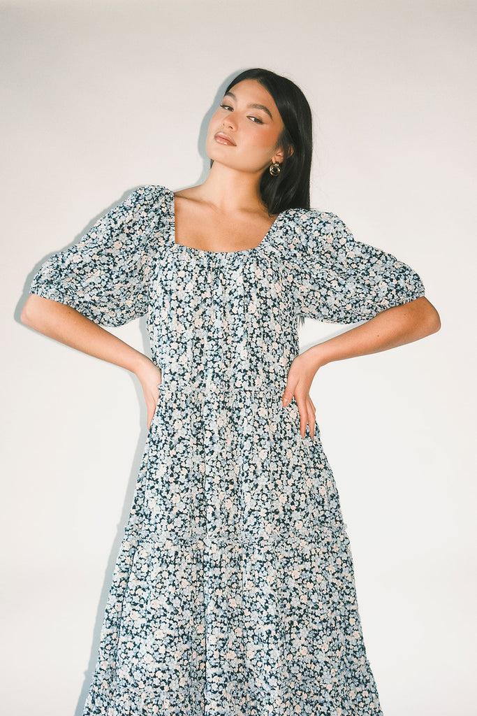 puff sleeve blue floral maxi dress with an elastic neckline. perfect for weddings, baby showers, and family pictures.
