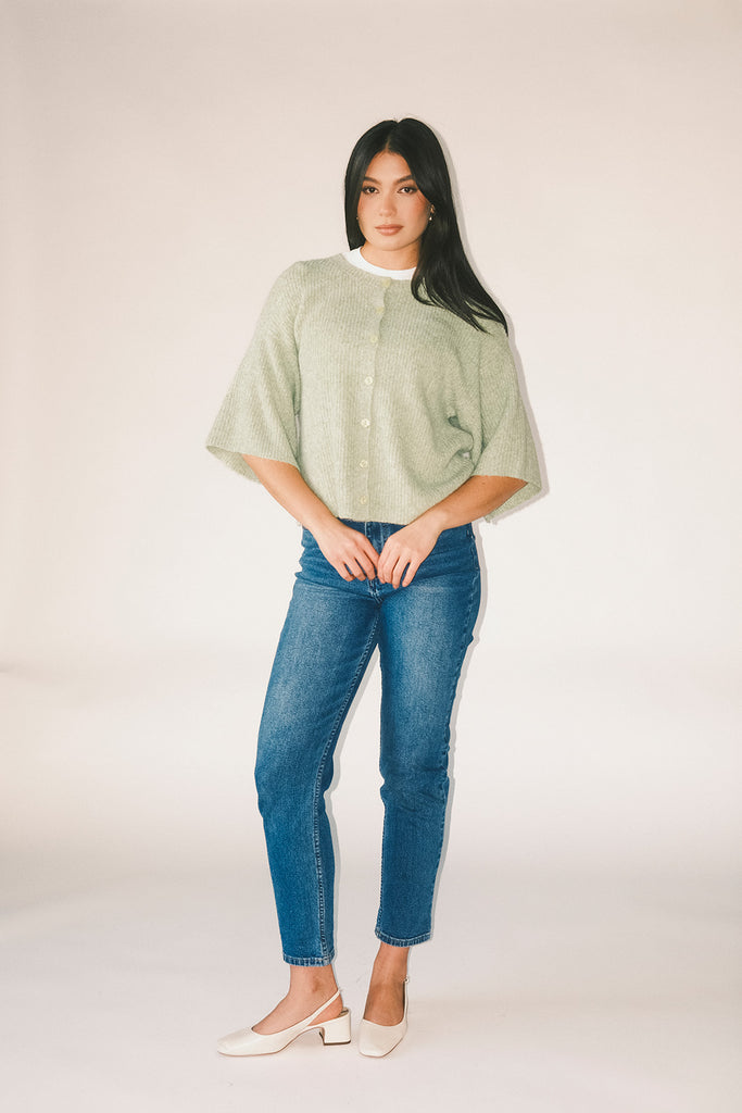 light green short sleeve cardigan with a slouchy, relaxed fit. perfect for casual outfits + lightweight layering.