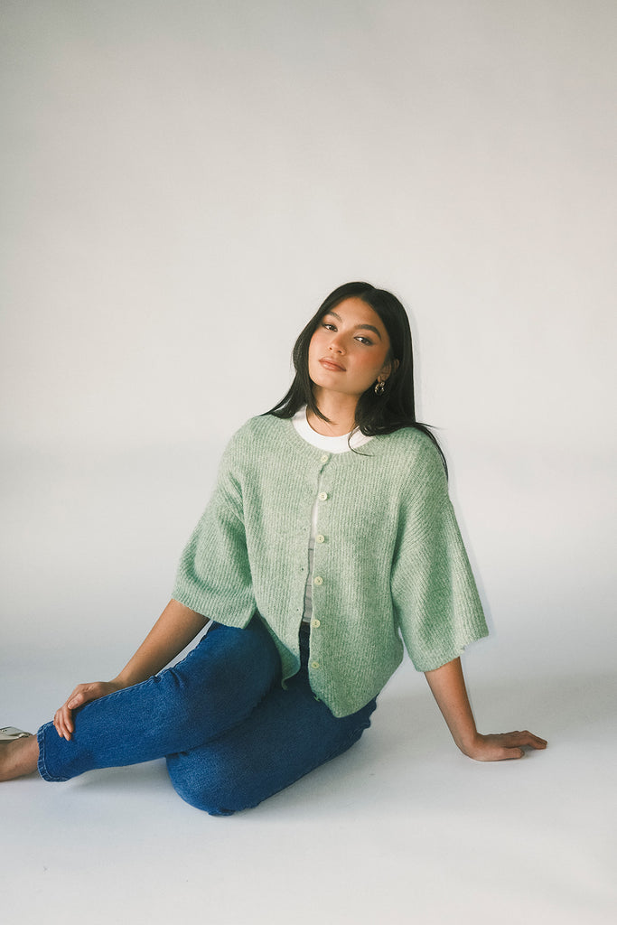 light green short sleeve cardigan with a slouchy, relaxed fit. perfect for casual outfits + lightweight layering.