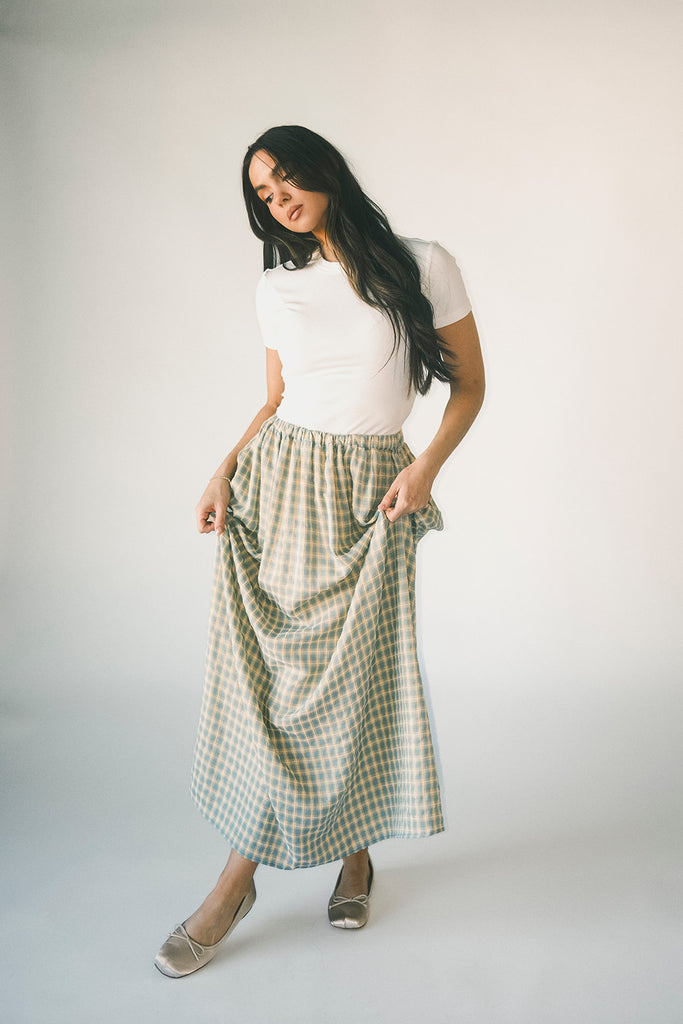 a classic plain white baby tee with a slightly cropped silhouette. the perfect fitted white t-shirt for everyday wear + casual outfit styling.