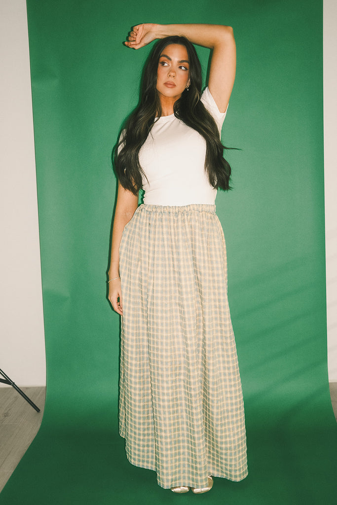 a classic plain white baby tee with a slightly cropped silhouette. the perfect fitted white t-shirt for everyday wear + casual outfit styling.