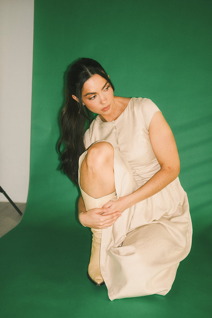 vintage-inspired dress with a fitted button-up bodice. the perfect neutral short sleeve dress for family pictures, bridal showers, + semi-formal events.