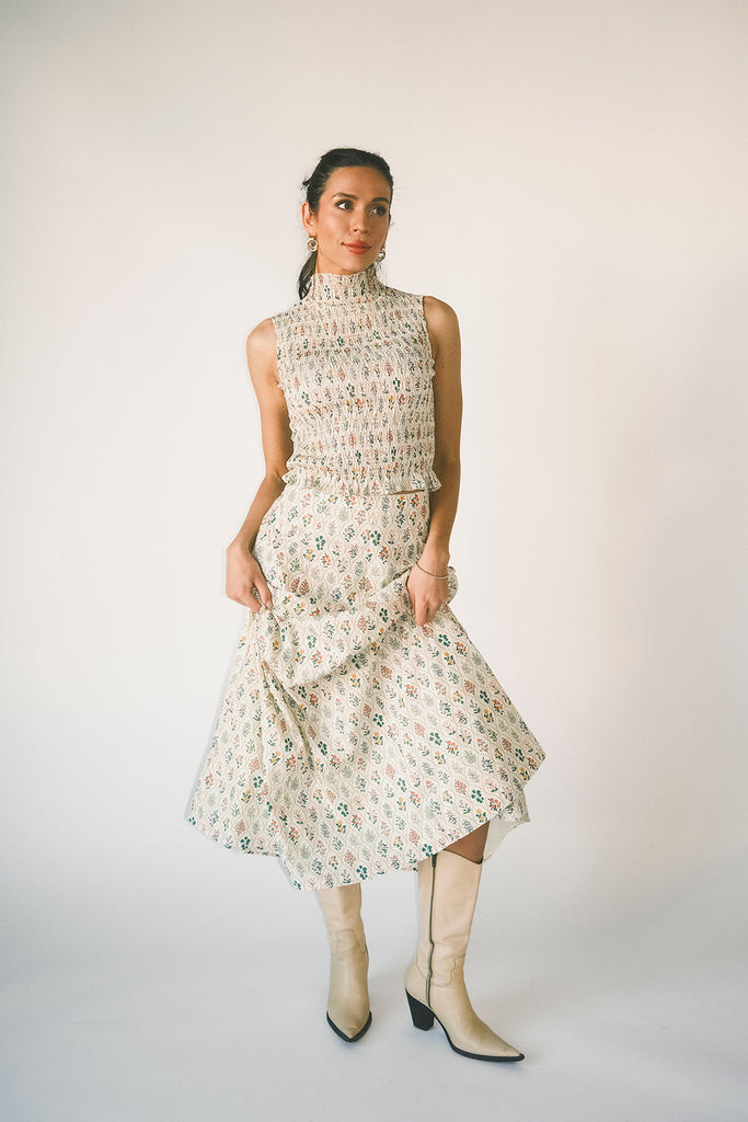 floral skirt set with a smocked mock neck tank + an a-line maxi skirt. the perfect elevated set for vacations, weddings, + fancy date nights.