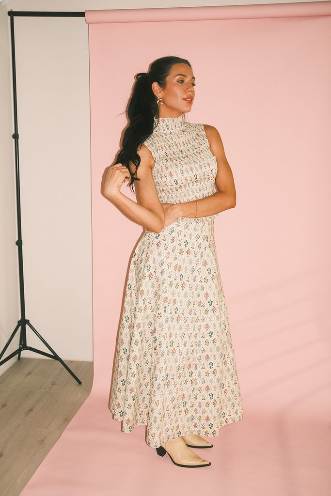 floral skirt set with a smocked mock neck tank + an a-line maxi skirt. the perfect elevated set for vacations, weddings, + fancy date nights.
