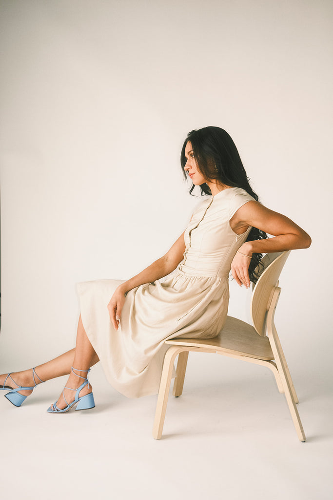 vintage-inspired dress with a fitted button-up bodice. the perfect neutral short sleeve dress for family pictures, bridal showers, + semi-formal events.