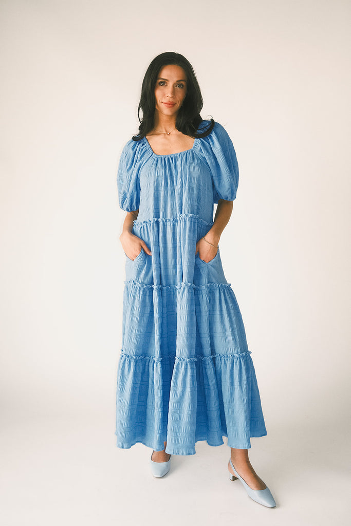 zoco daymaker dress: puff sleeve blue maxi dress with an elastic neckline. perfect for weddings, baby showers, and family pictures.