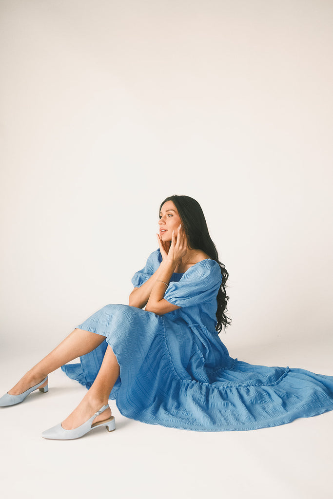 zoco daymaker dress: puff sleeve blue maxi dress with an elastic neckline. perfect for weddings, baby showers, and family pictures.