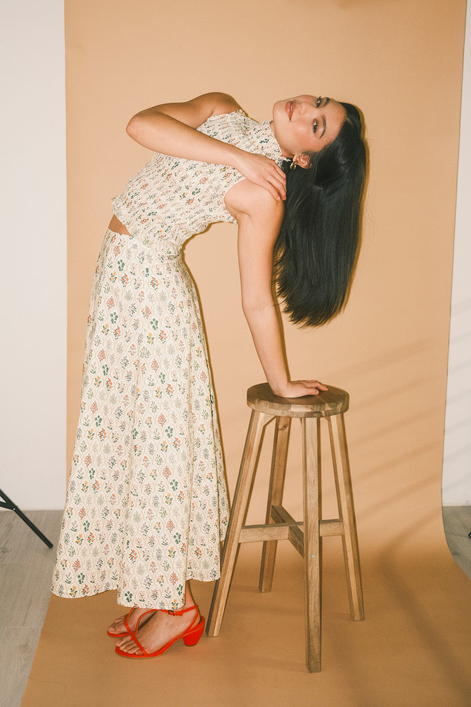 floral skirt set with a smocked mock neck tank + an a-line maxi skirt. the perfect elevated set for vacations, weddings, + fancy date nights.