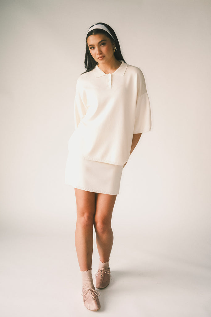 a casual skirt set with an oversized polo top + a fitted mini skirt. the perfect sporty two piece set to dress up or down for any outfit idea.