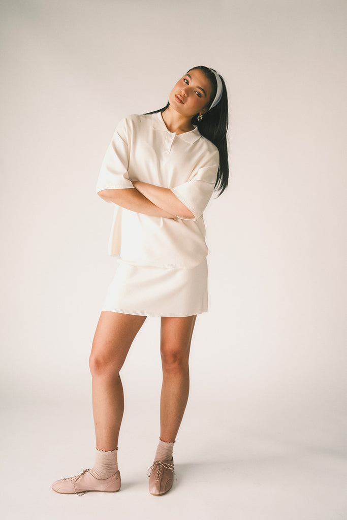 a casual skirt set with an oversized polo top + a fitted mini skirt. the perfect sporty two piece set to dress up or down for any outfit idea.