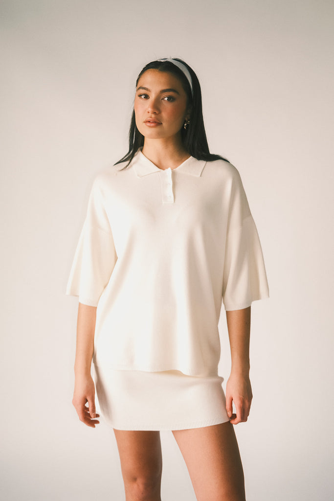 a casual skirt set with an oversized polo top + a fitted mini skirt. the perfect sporty two piece set to dress up or down for any outfit idea.