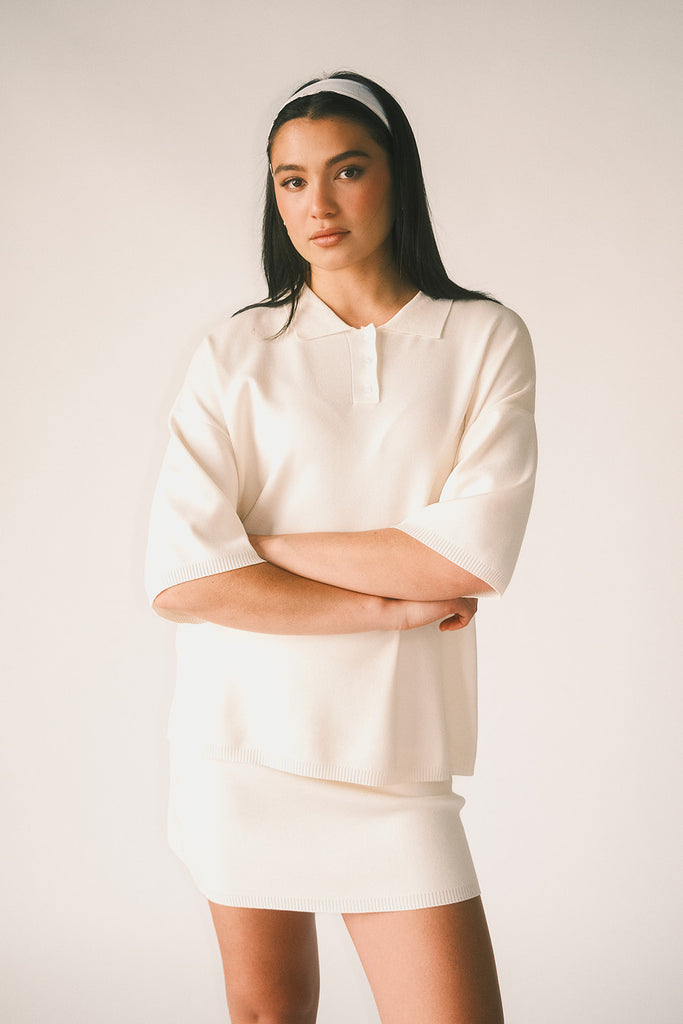a casual skirt set with an oversized polo top + a fitted mini skirt. the perfect sporty two piece set to dress up or down for any outfit idea.